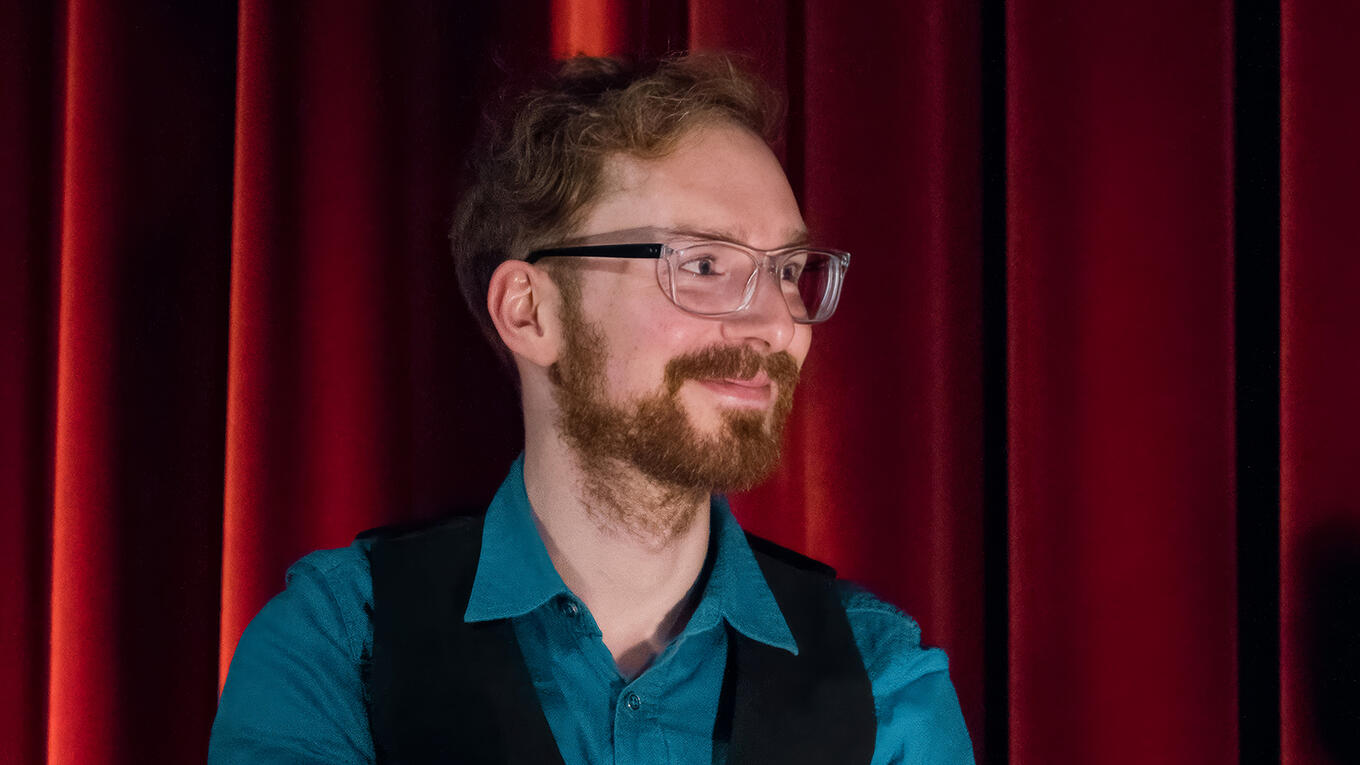 Christopher Klinger, composer for the Idle Films Anthology, answering questions on stage.