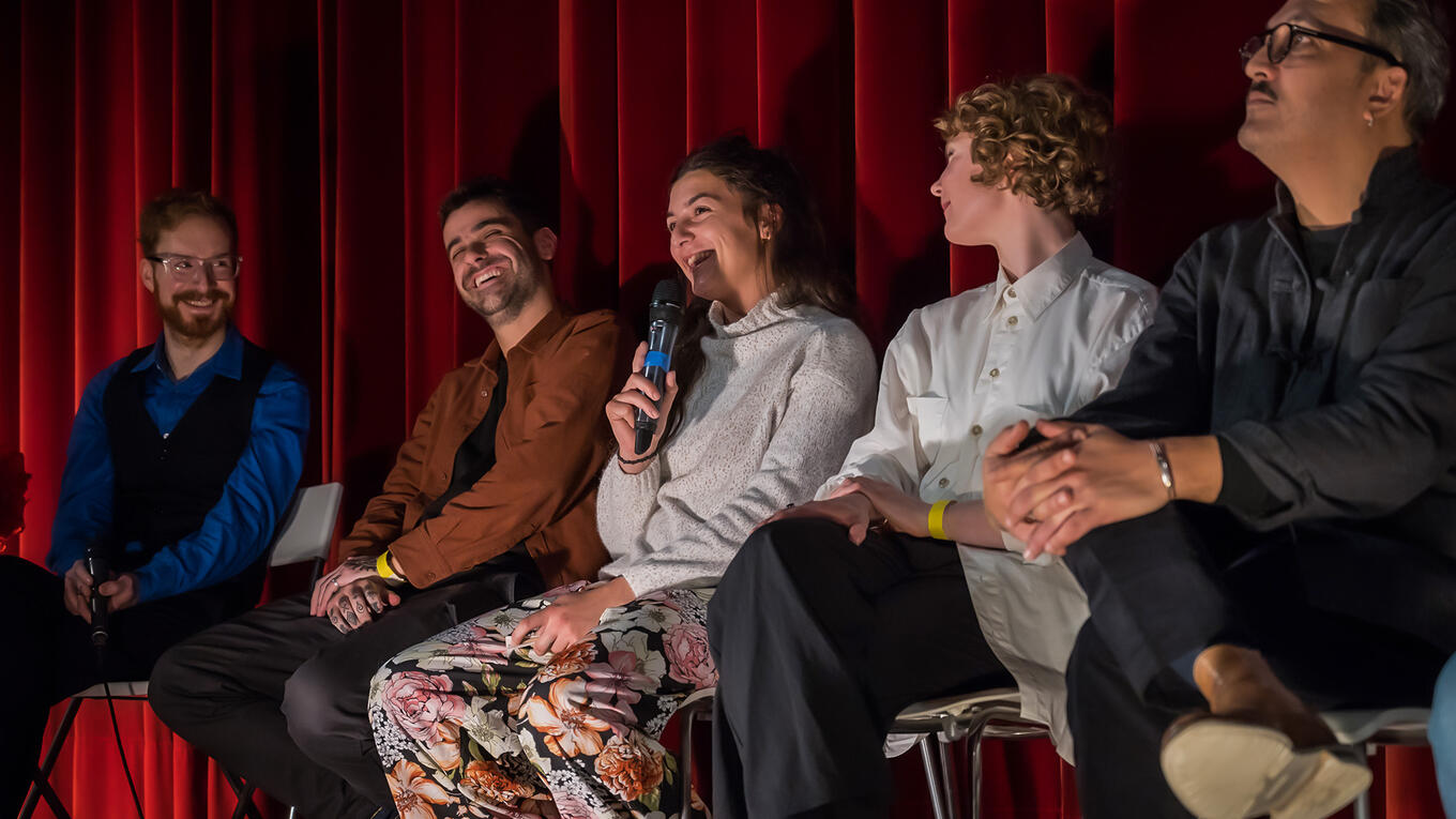 Actress Eva Faure speaking during Q&A at Hamburg premiere, discussing her role in Hitchhiking as a first-time performer.
