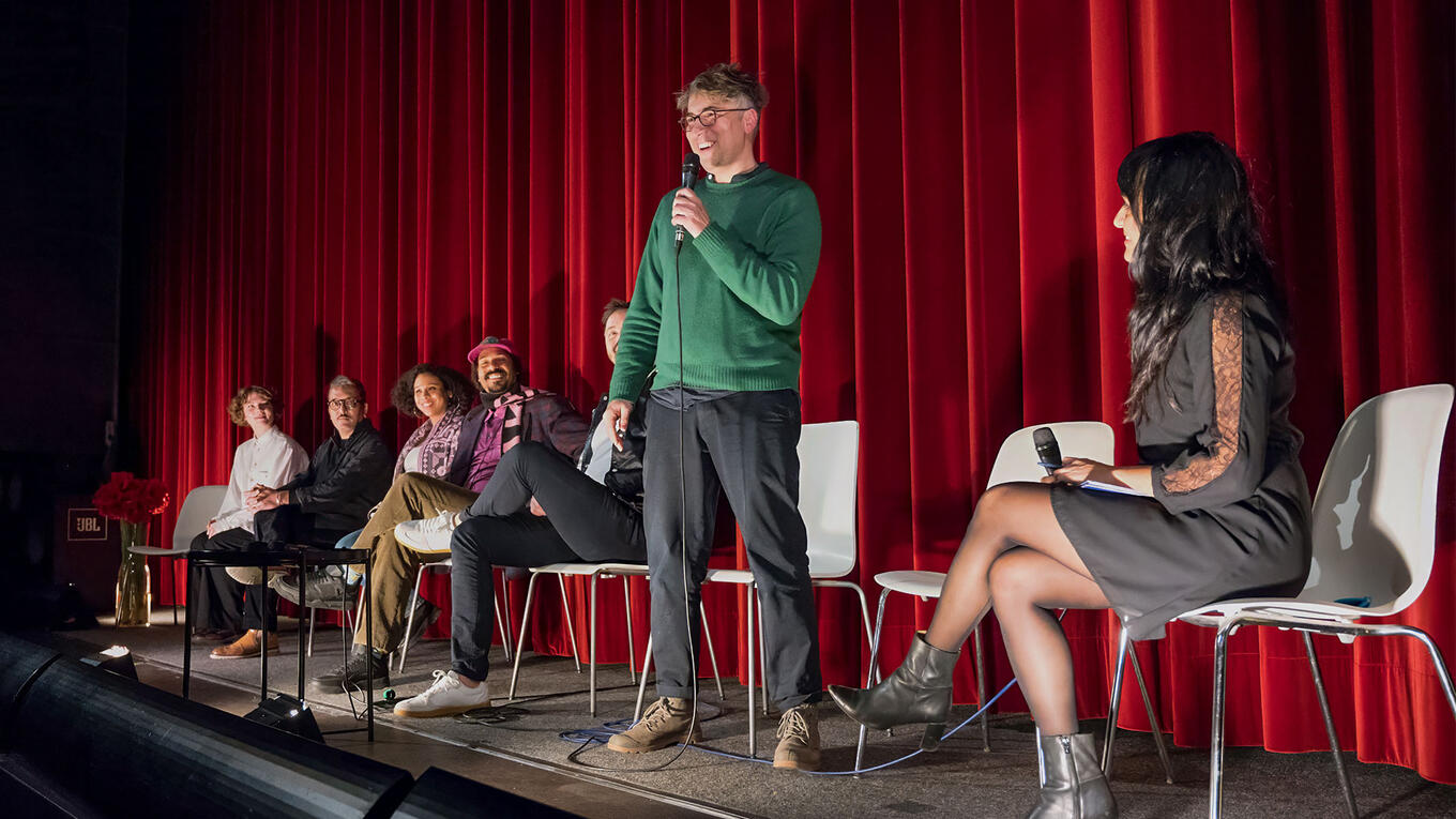 Iliès Terki speaking on stage during the Hamburg premiere Q&A at Zeise Kino, 2023.